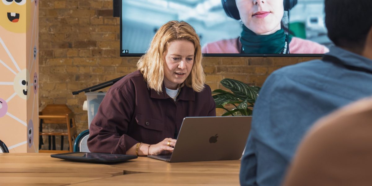 A diverse group of professionals connecting and collaborating virtually, symbolizing strong team bonds.