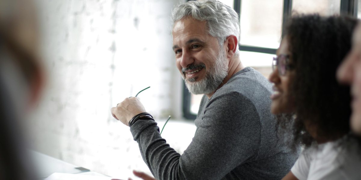 A diverse group of professionals from different backgrounds actively participating and connecting in a virtual setting.