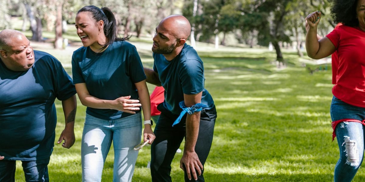A diverse team laughing and connecting during a fun activity, fostering real bonds.
