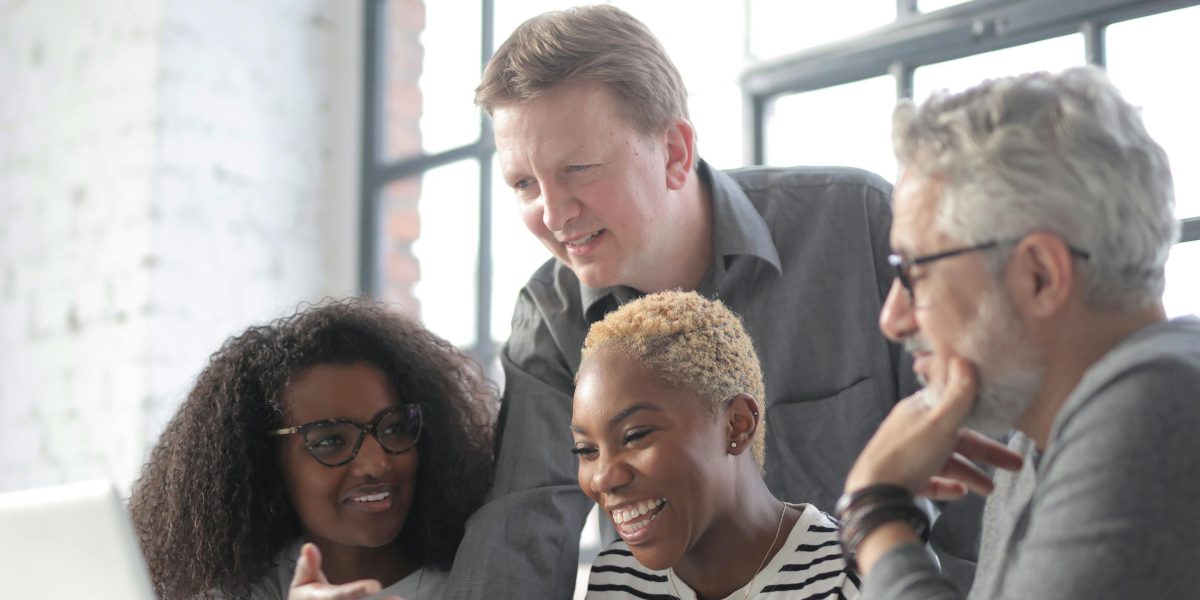 Team members enjoying a moment of shared laughter, symbolizing the emotional connection fostered by team activities.